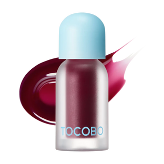 Tocobo Juicy Berry Lip Oil - flacon givre bordeaux avec bouchon bleu et trace de couleur prune