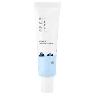 ROUND LAB 1025 Dokdo Eye Cream 30ml - tube de crème yeux blanc et bleu illustré d'îlots et d'un phoque