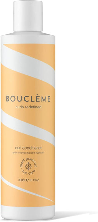 Boucleme Curl Conditioner flacon 300 ml orange et blanc a rayures sur fond blanc