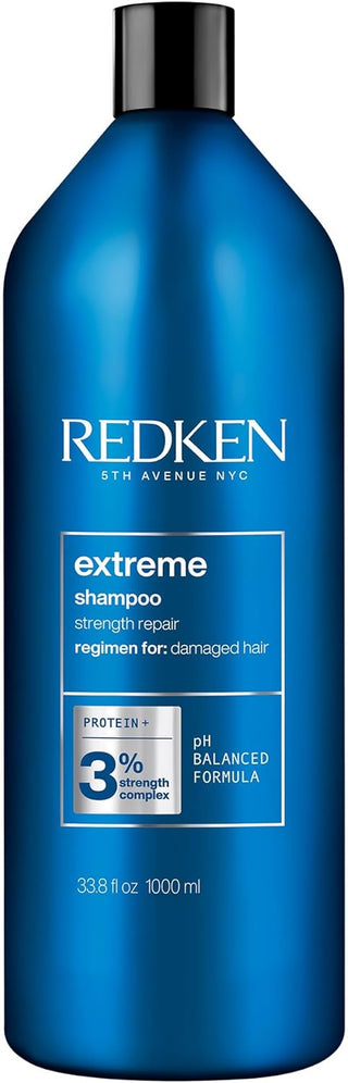 Flacon bleu REDKEN Extreme Shampoo 1000ml avec bouchon noir, formule Protein+ 3% sur fond blanc