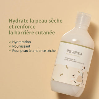 Round Lab Toner Soja Noir - flacon incline sur fond beige avec mentions hydratation barriere cutanee