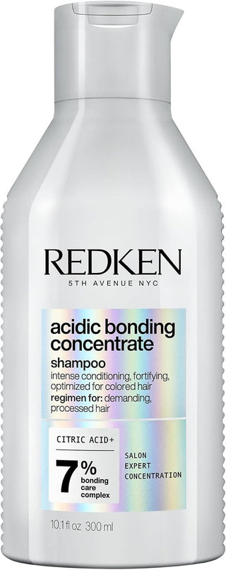 Flacon argente REDKEN Acidic Bonding Concentrate Shampoo 300ml, Citric Acid+ 7% sur fond blanc