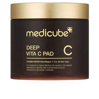 Pot brun Medicube Deep Vita C Pad 70 pads avec couvercle dore et lettrage or sur fond blanc