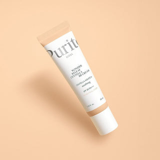 PURITO SEOUL Wonder Releaf Centella BB Cream #13 tube blanc incline sur fond peche pastel