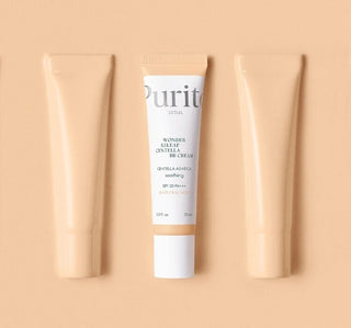 Trois tubes PURITO SEOUL BB Cream Centella #13 alignes sur fond peche, tube central face visible