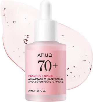 ANUA Peach 70 Niacin Serum - flacon rose avec tache de texture rose peche en arriere-plan