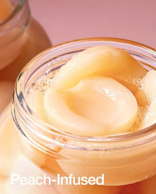 ANUA Serum Peche - extrait de peche infuse dans un bocal en verre, ingredient cle du serum