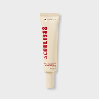 Tube beige Seoul 1988 Eye Cream K-Secret au retinal 4% sur fond gris clair, logo rouge visible