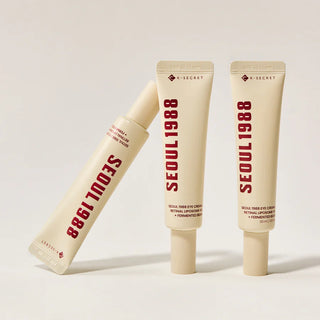 Trois tubes KSECRET Seoul 1988 Eye Cream Retinal 4% poses ensemble sur fond gris clair