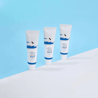 Trio de tubes Round Lab Birch Juice Sun Cream alignes sur fond bleu et blanc