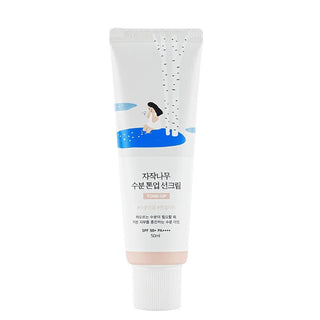 Tube Round Lab Birch Tone-Up Sunscreen SPF50+ 50ml, packaging blanc illustre avec bouleau et eau