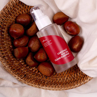Flacon ISNTREE Chestnut AHA 8% Clear Essence pose dans un panier en osier entoure de chataignes