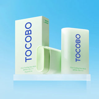 Boîte vegan et stick TOCOBO Cica Cooling Sun Stick SPF50+ 18g ouvert montrant le baume vert