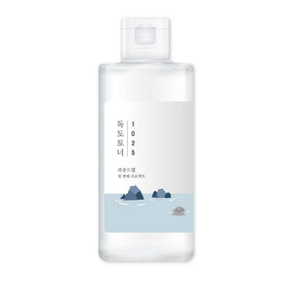 Round Lab 1025 Dokdo Lotion - flacon blanc vu de face, etiquette illustree ilots et phoque sur fond blanc