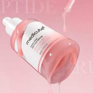 Medicube PDRN Pink Peptide Serum renverse avec texture gel rose coulant sur le flacon
