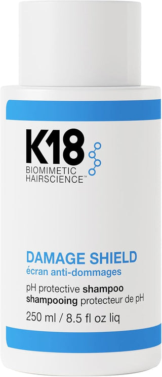 K18 Damage Shield pH Shampoo 250 ml - flacon blanc avec bandes bleues et bouchon blanc sur fond blanc