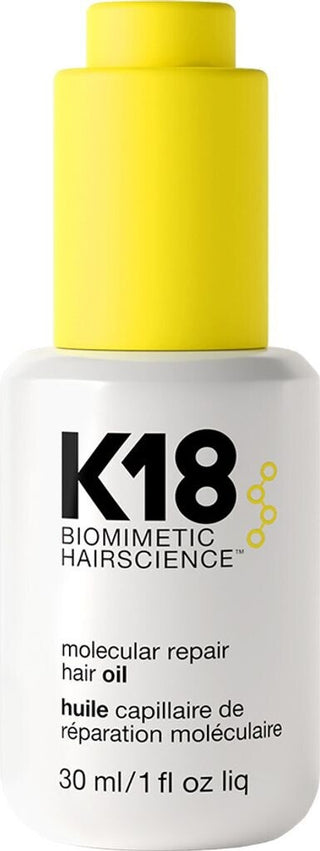 K18 Molecular Repair Hair Oil 30 ml - vue rapprochee du flacon blanc avec bouchon jaune sur fond blanc