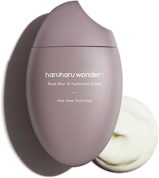 Pot mauve ovale Haruharu Wonder Black Rice 10 Hyaluronic Cream 50 ml ouvert laissant voir la creme blanche