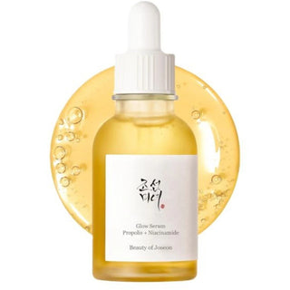 Flacon compte-gouttes Beauty of Joseon Glow Serum Propolis + Niacinamide sur cercle de sérum doré
