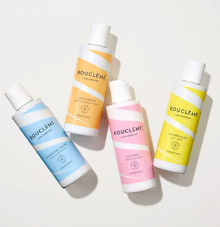 Boucleme Starter Kit - quatre flacons shampoing, apres-shampoing, curl cream et gel poses a plat